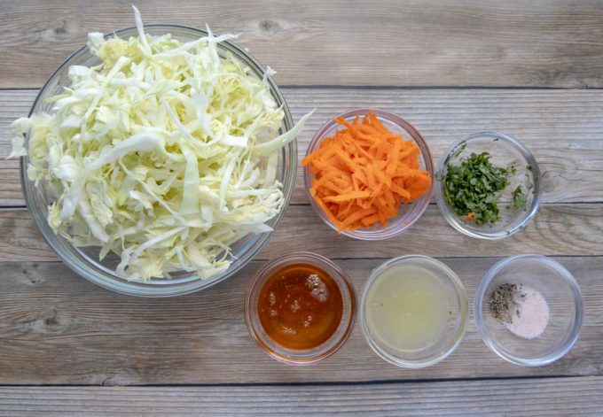ingredients to make asian slaw in glass bowls