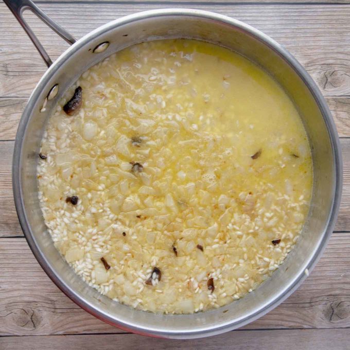 broth added to risotto in large saute pan
