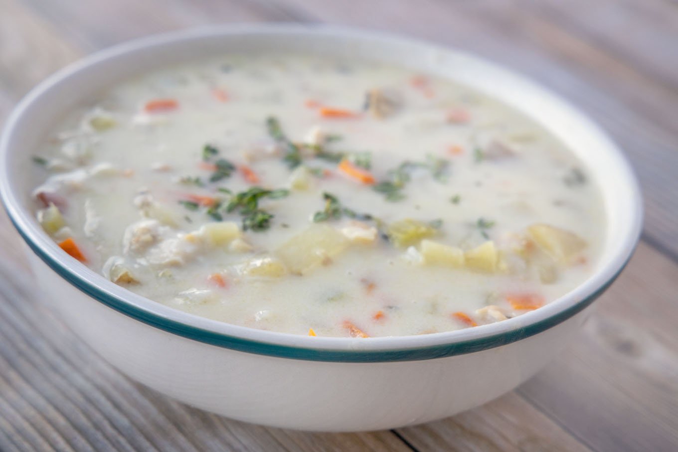 white bowl with new england clam chowder