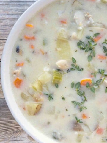 overhead view of white bowl of New England Clam Chowder