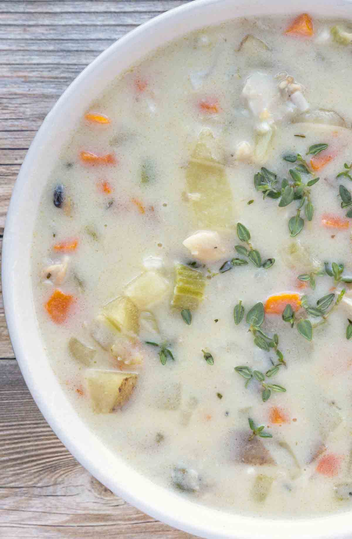 overhead view of white bowl of New England Clam Chowder