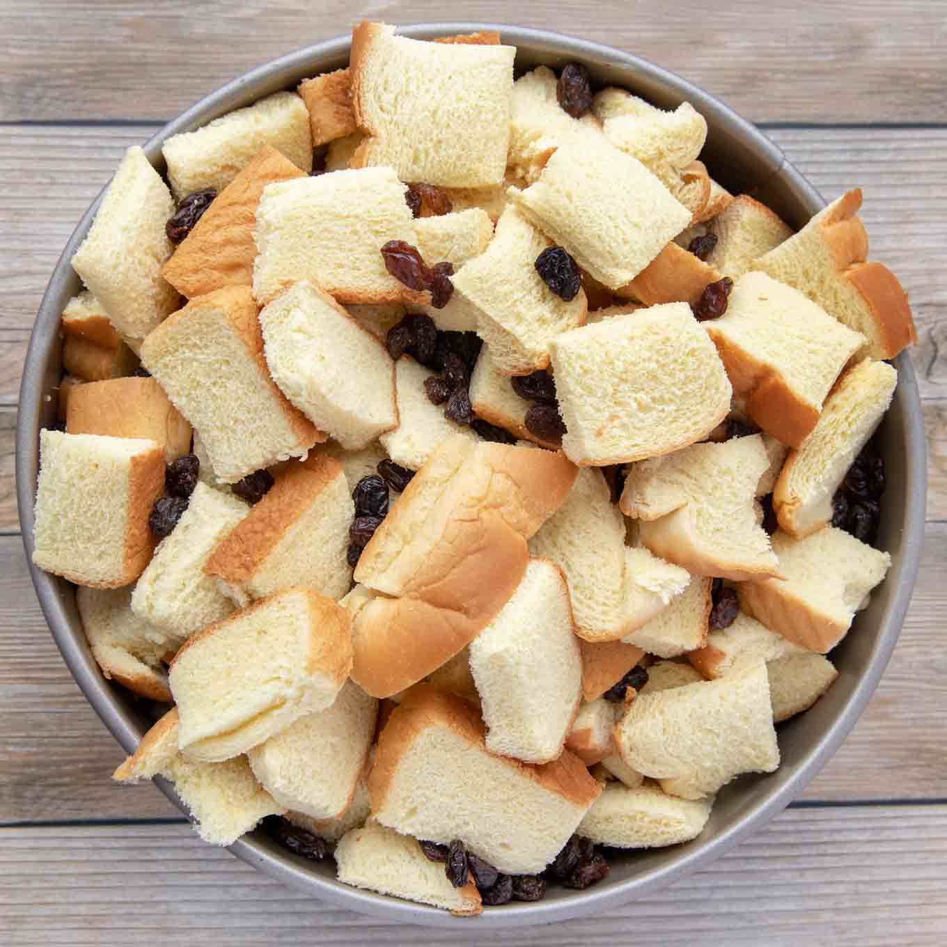 bread cubes and raisins in a springform pan