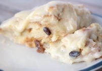 bread pudding with cream cheese frosting on a plate