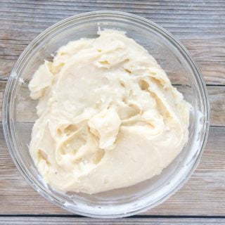cream cheese frosting in a glass bowl