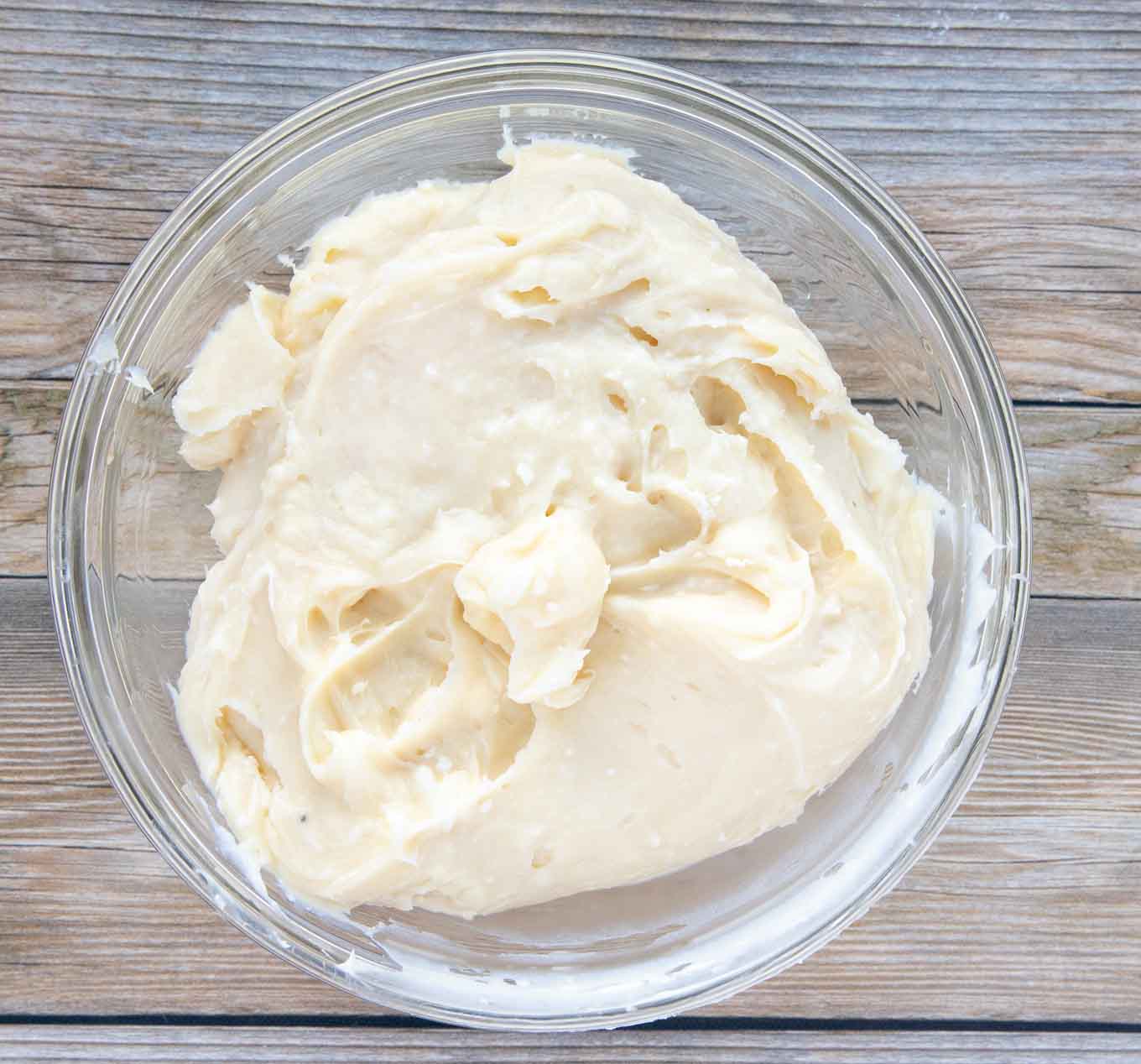 cream cheese frosting in a glass bowl