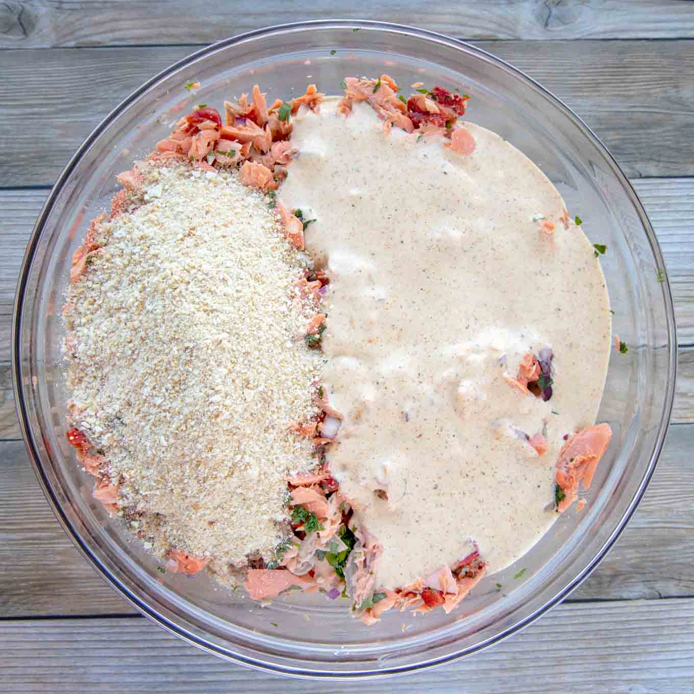 imperial sauce and bread crumbs added to bowl of salmon mixture