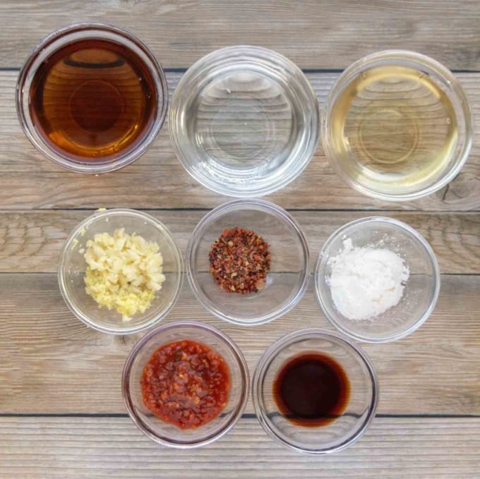ingredients to make sweet chili sauce in glass bowls
