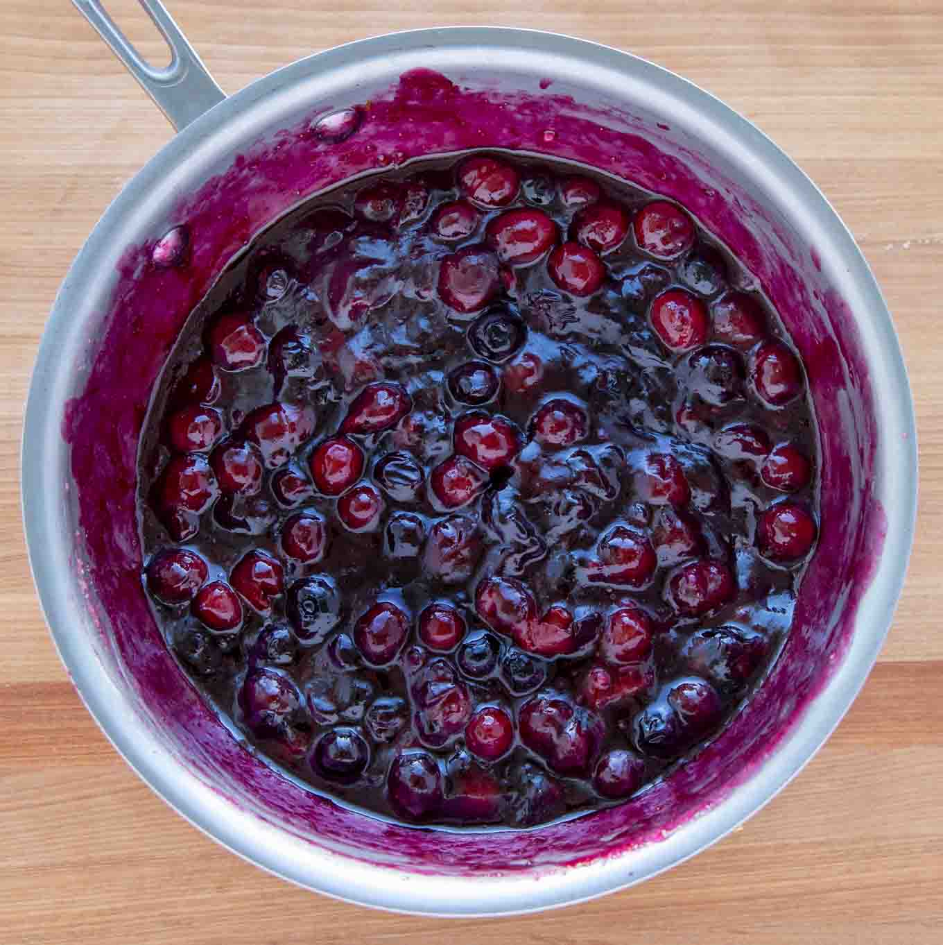 cooked cheesecake topping in a saucepan