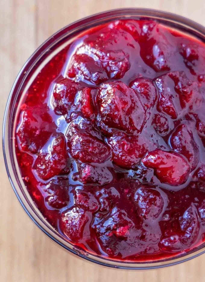 overhead partial shot of a bowl of cranberry sauce