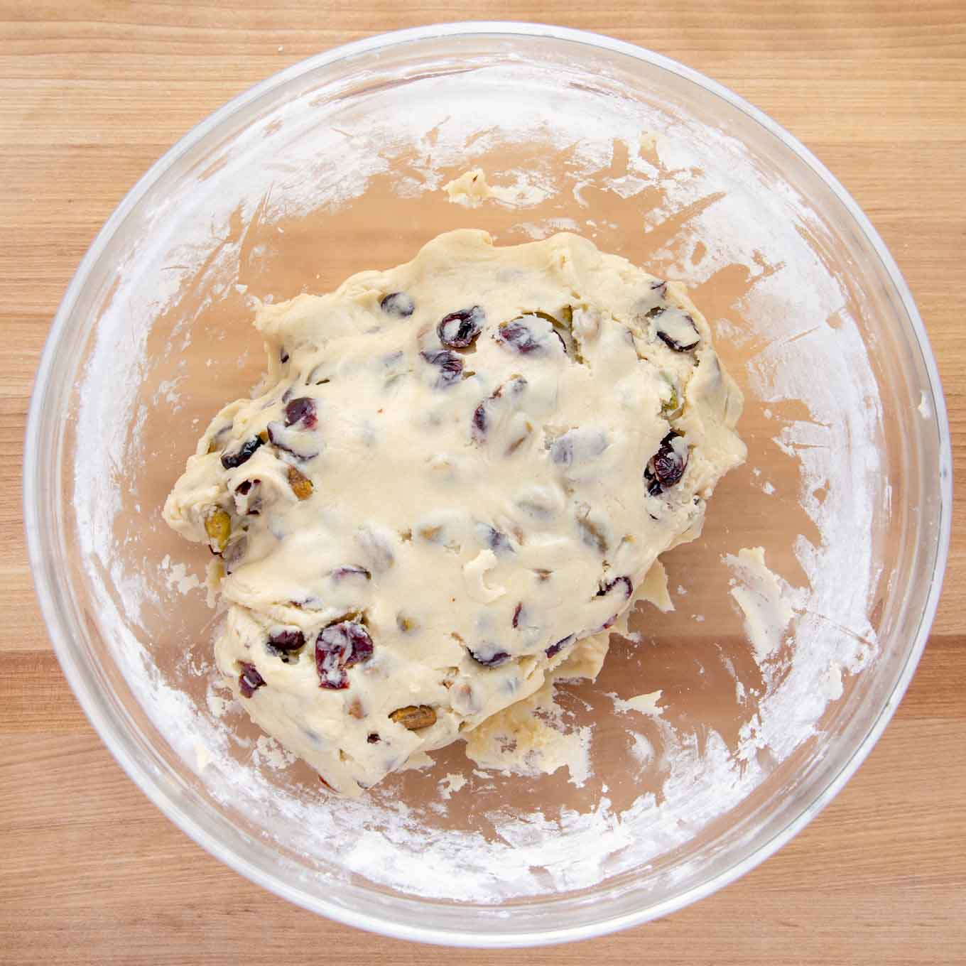 finished dough in glass bowl