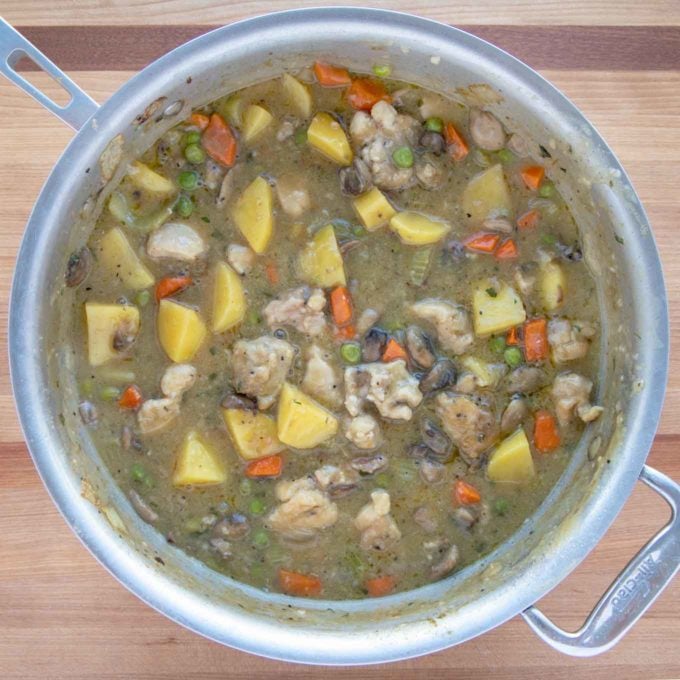 cooked chicken stew in large pot.