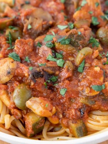 vegetarian sauce over pasta in a white bowl