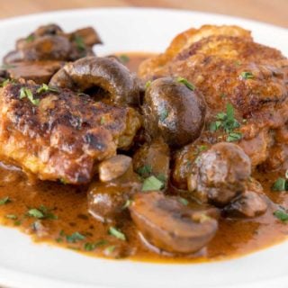 chicken chasseur on a white plate