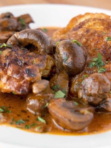 chicken chasseur on a white plate