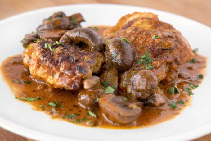 chicken chasseur on a white plate