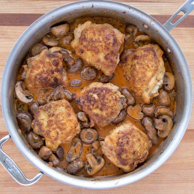 chicken added to the mushroom sauce in the skillet