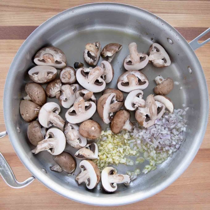 mushrooms, shallots and garlic with olive oil in the skillet