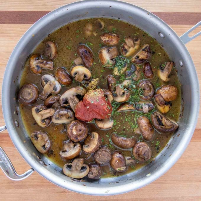 tomato paste, stock and tarragon added to the skillet