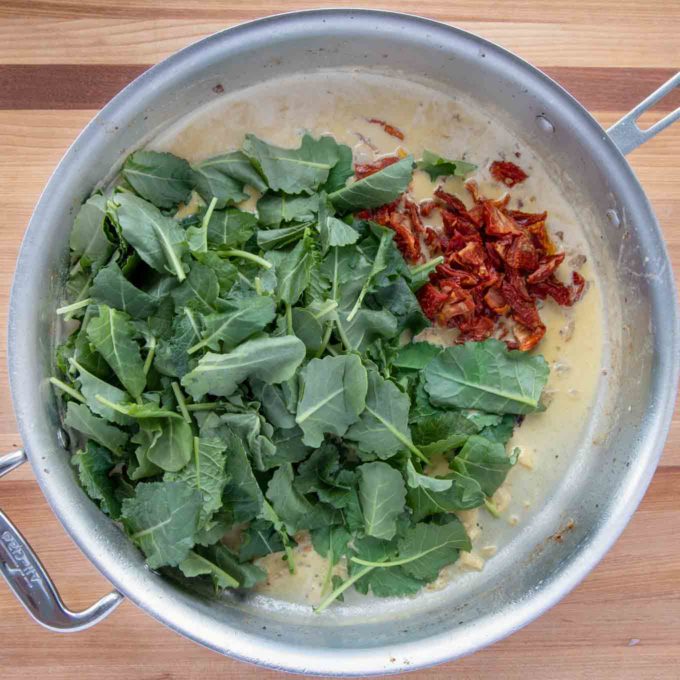 spinach and sun dried tomatoes added to the skillet