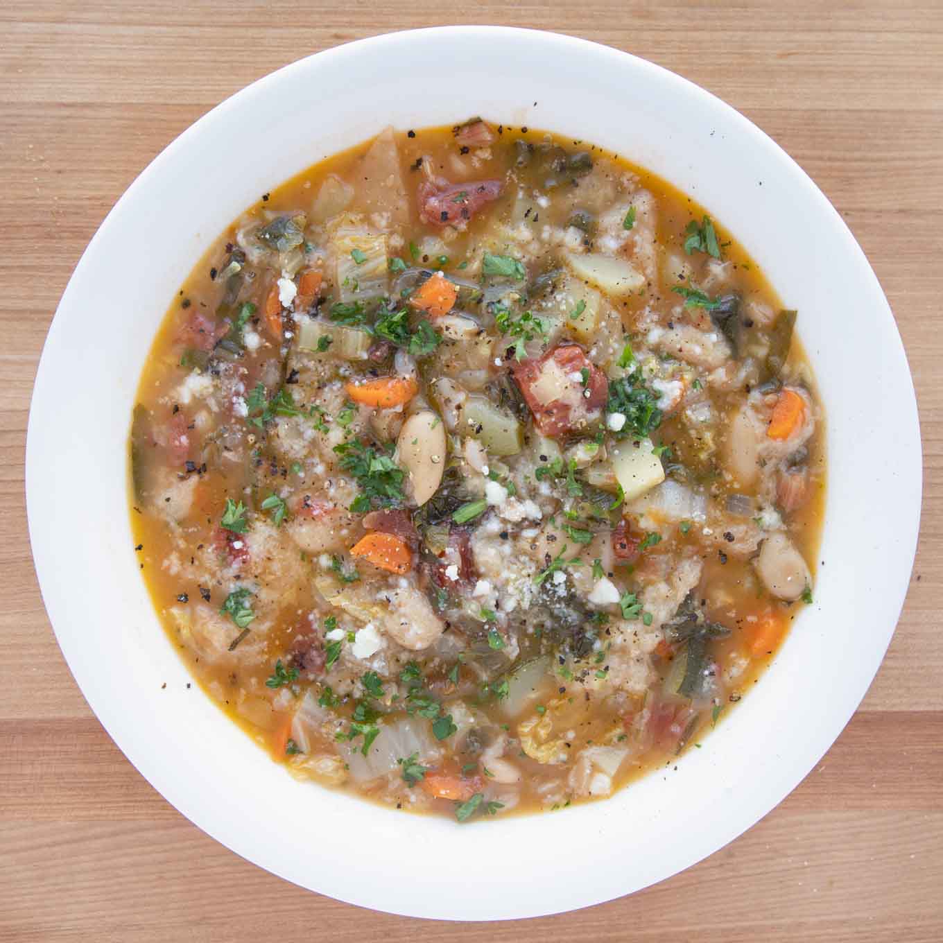 Tuscan bread soup in a white bowl