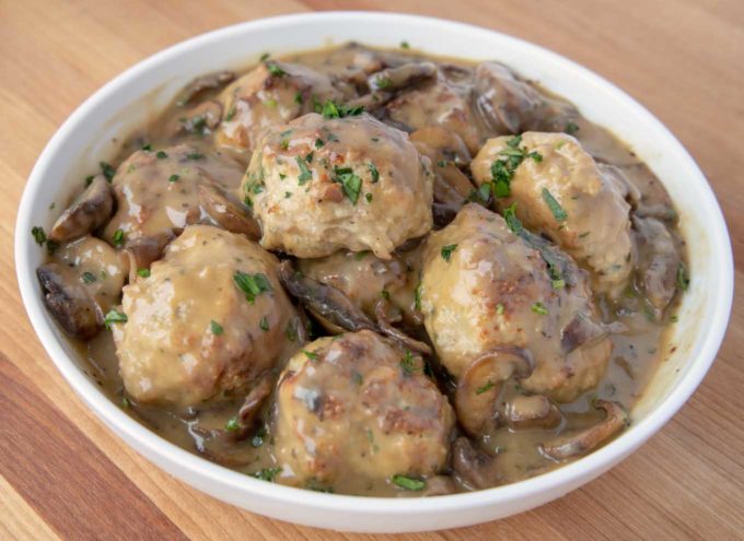 chicken marsala meatballs in a white bowl