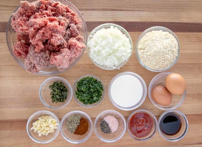 Ingredients to make meatloaf on a cutting board