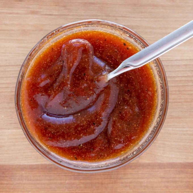 glaze in a glass bowl with spoon in it