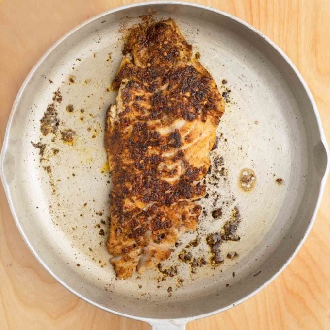 pan seared cajun style Florida snapper in a skillet