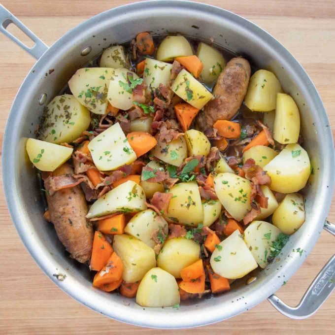 fully cooked Dublin Coddle in pot seasoned with parsley