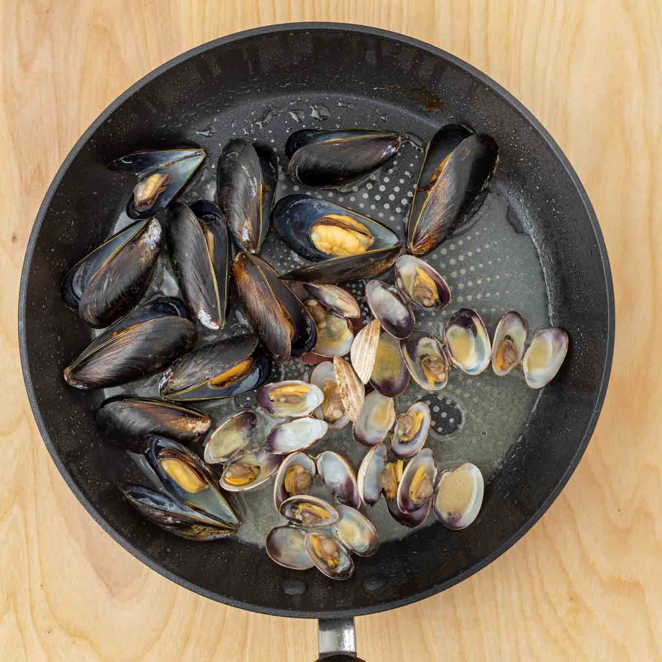 mussels and clams in a pan