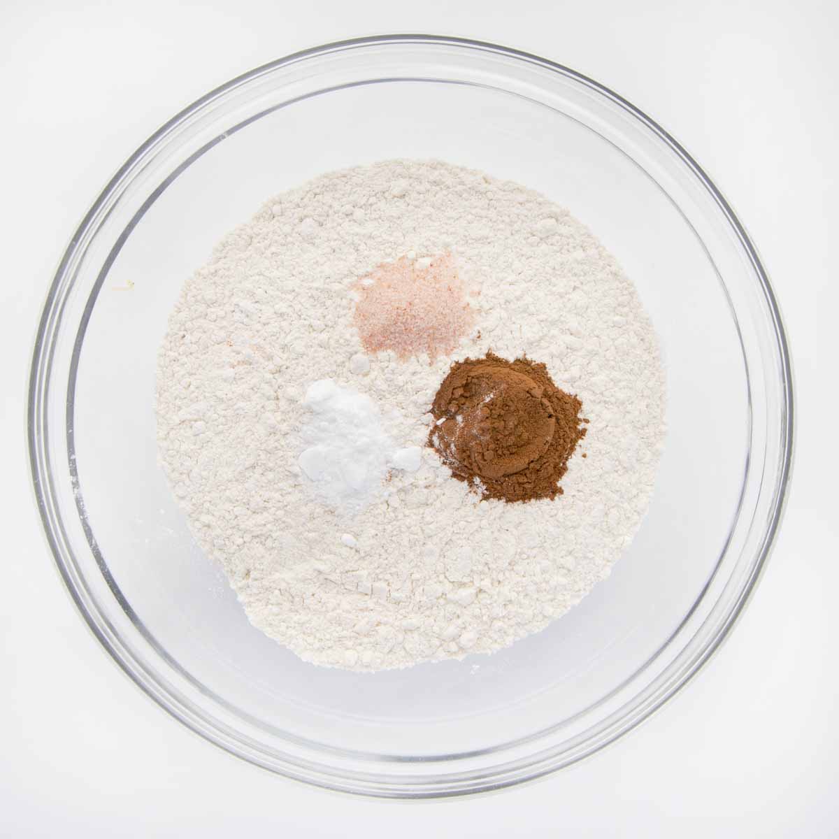 overhead view of flour mixture in a glass bowl