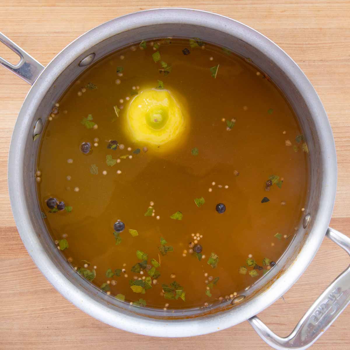 pot with seasoned water to cook shrimp