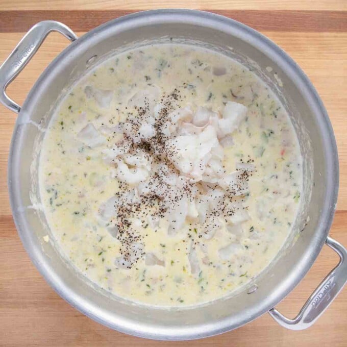 adding halibut to the pot and re-seasoning soup