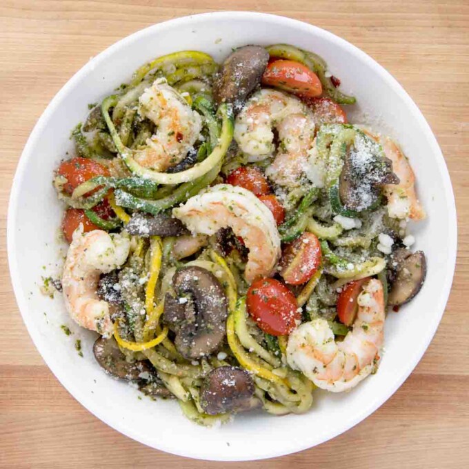 shrimp and zoodles in a white bowl