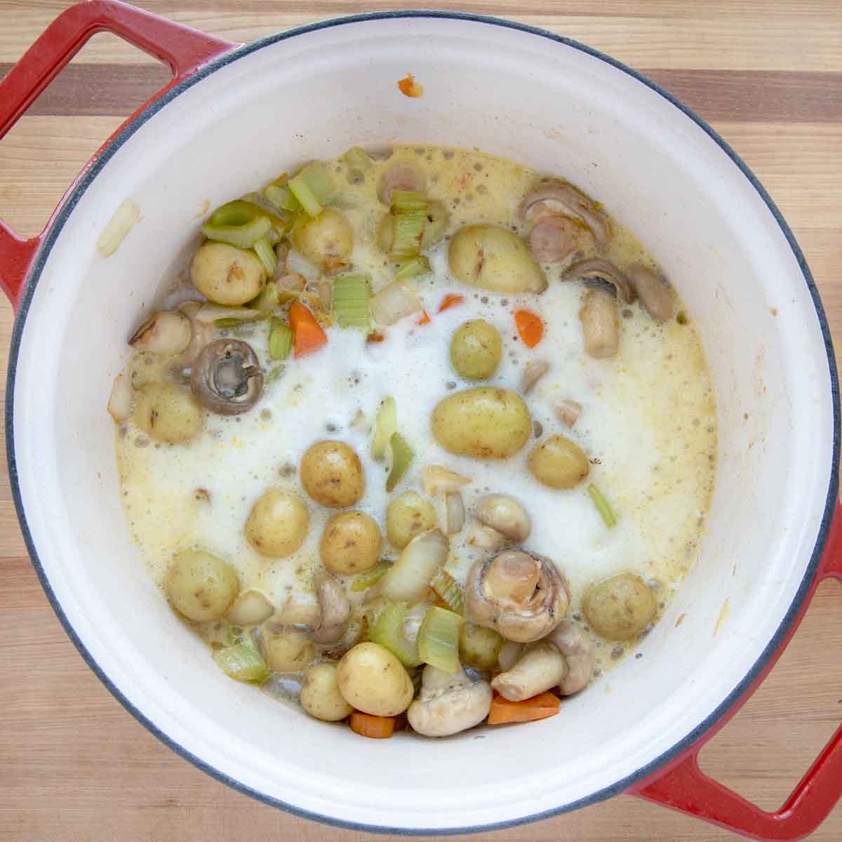 beer added to the vegetables in the dutch oven