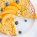 overhead view of peaches and cream breakfast cake with a slice cut out