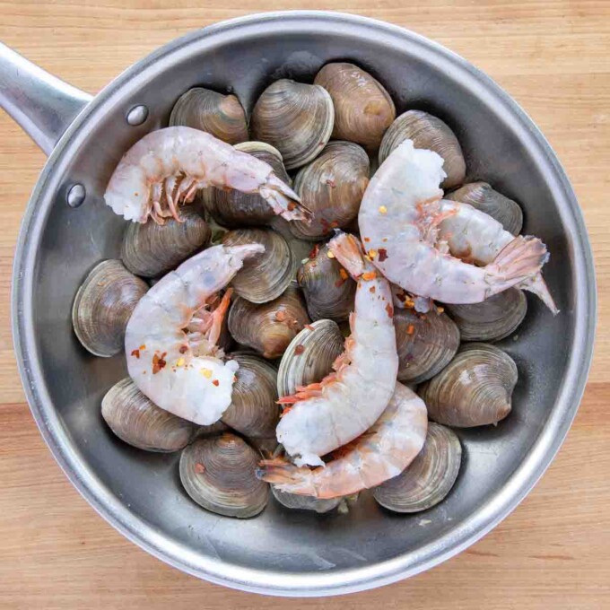 clams and shrimp in saute pan
