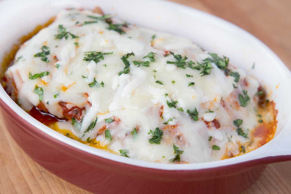 baked lasagna bolognese in individual baking dish