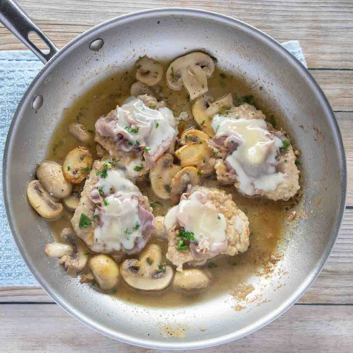 finished veal saltimbocca in a saute pan