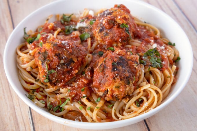 tuna meatballs and linguine in a white bowl