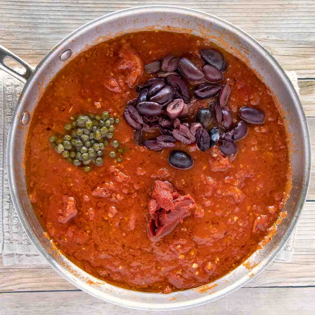 olives and capers added to the tomato mixture