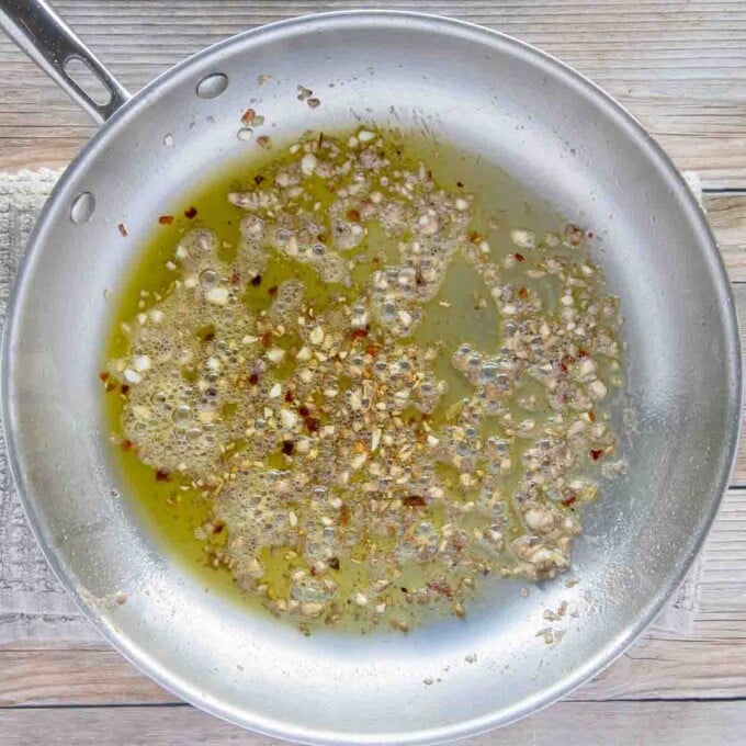 garlic, red pepper flakes and anchovy paste cooking in olive oil