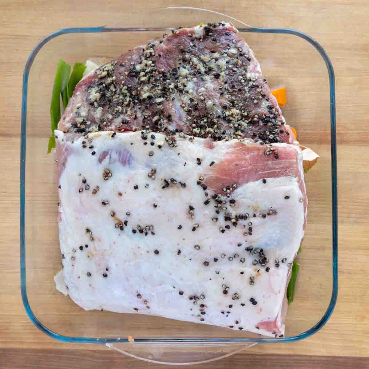 seasoned rack of pork in a baking dish