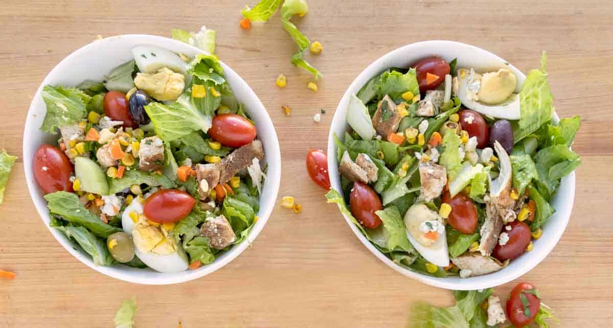 two bowls of prepared salad
