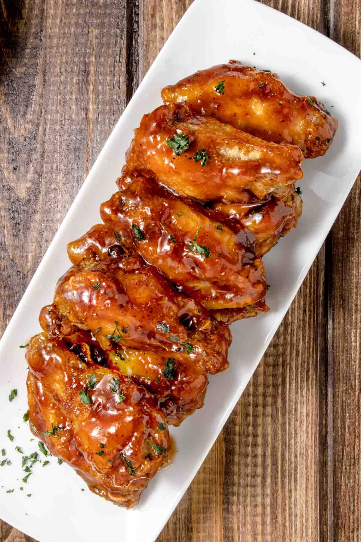 honey bbq chicken wings on a long white platter