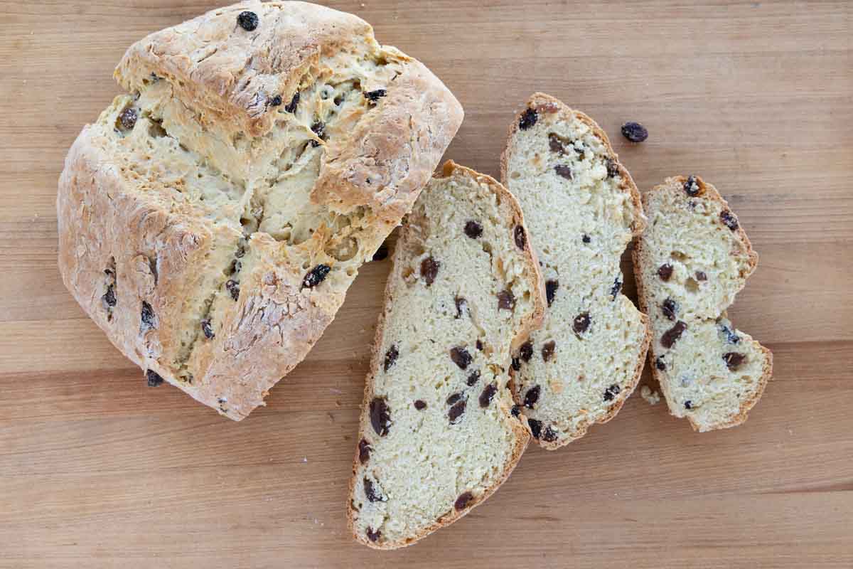 slices of Irish soda bread next to loaf