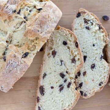 slices of Irish soda bread next to loaf