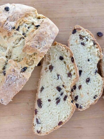 slices of Irish soda bread next to loaf