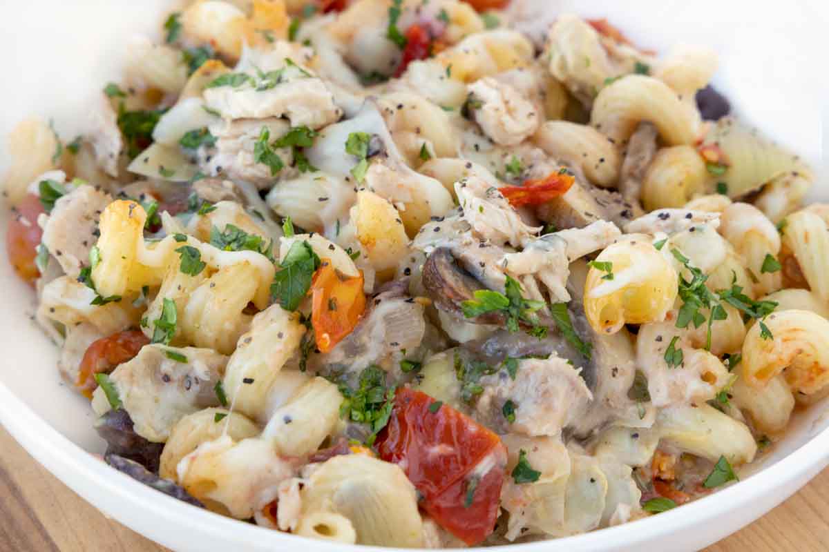 close up of tuna casserole in a white bowl