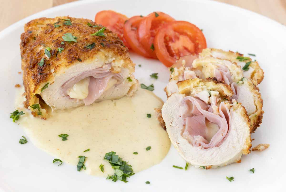 chicken cordon bleu sliced with slices fanned out on the dijon sauce